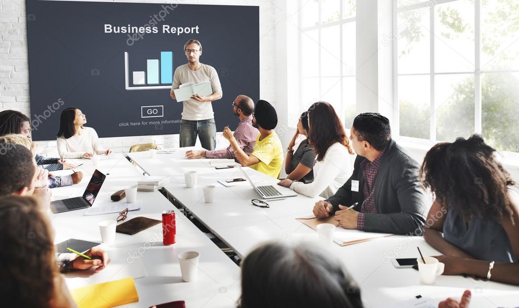 Executive team discussing reports in a boardroom